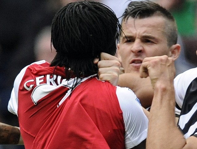Joey Barton  confronts Arsenal's  Gervinho